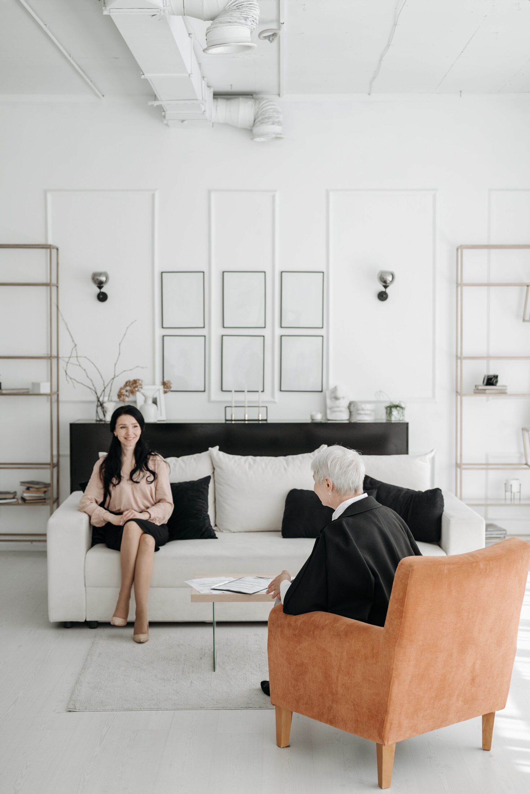 Candid image of a professional counseling session in a stylish modern living room, showcasing effective communication.